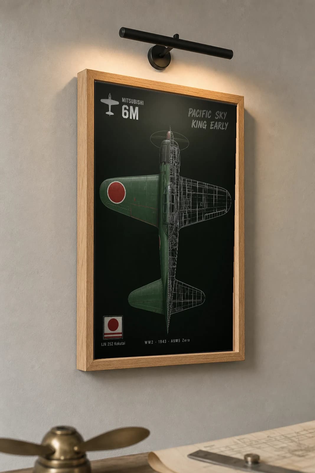 Mitsubishi A6M Zero Cutaway Poster — A6M5 Model 52 WW2 Split-View Blueprint Print — the framed print shown at a three-quarter angle on a styled gallery wall in a natural-oak frame