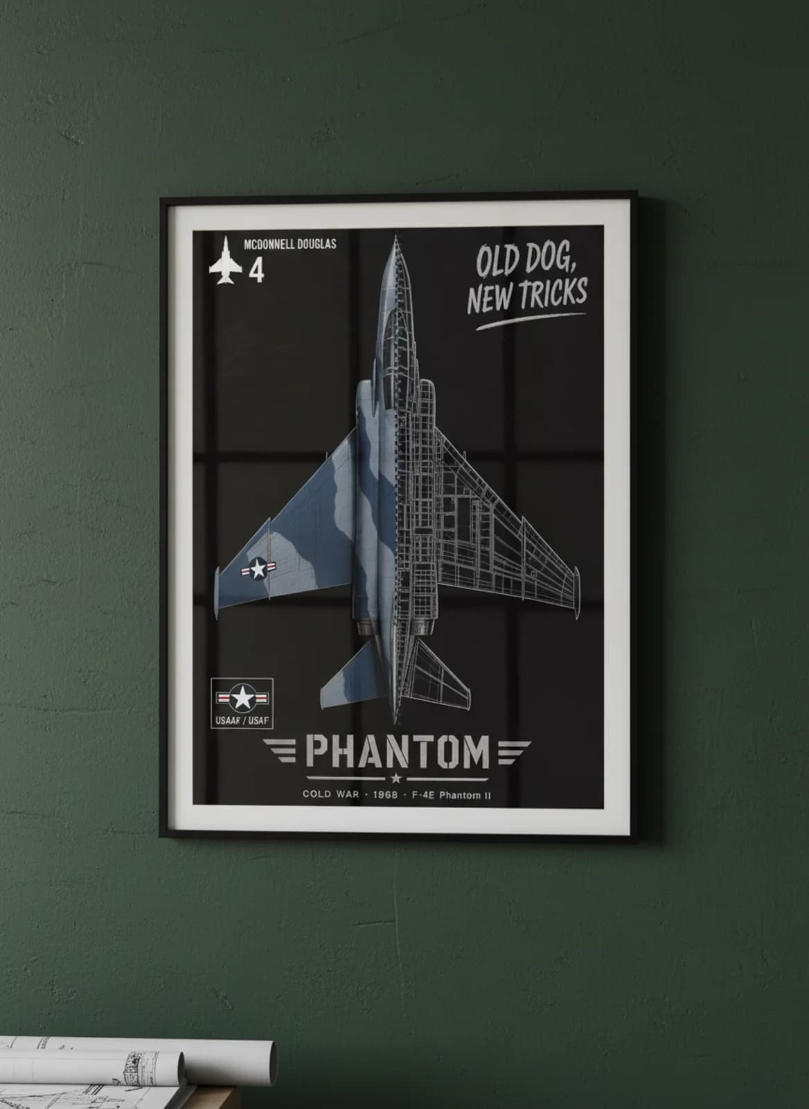 F-4E Phantom II cutaway poster in black A2 frame on sea-blue-grey-camo deep forest wall — Aircraft Cutaways enthusiast study mockup