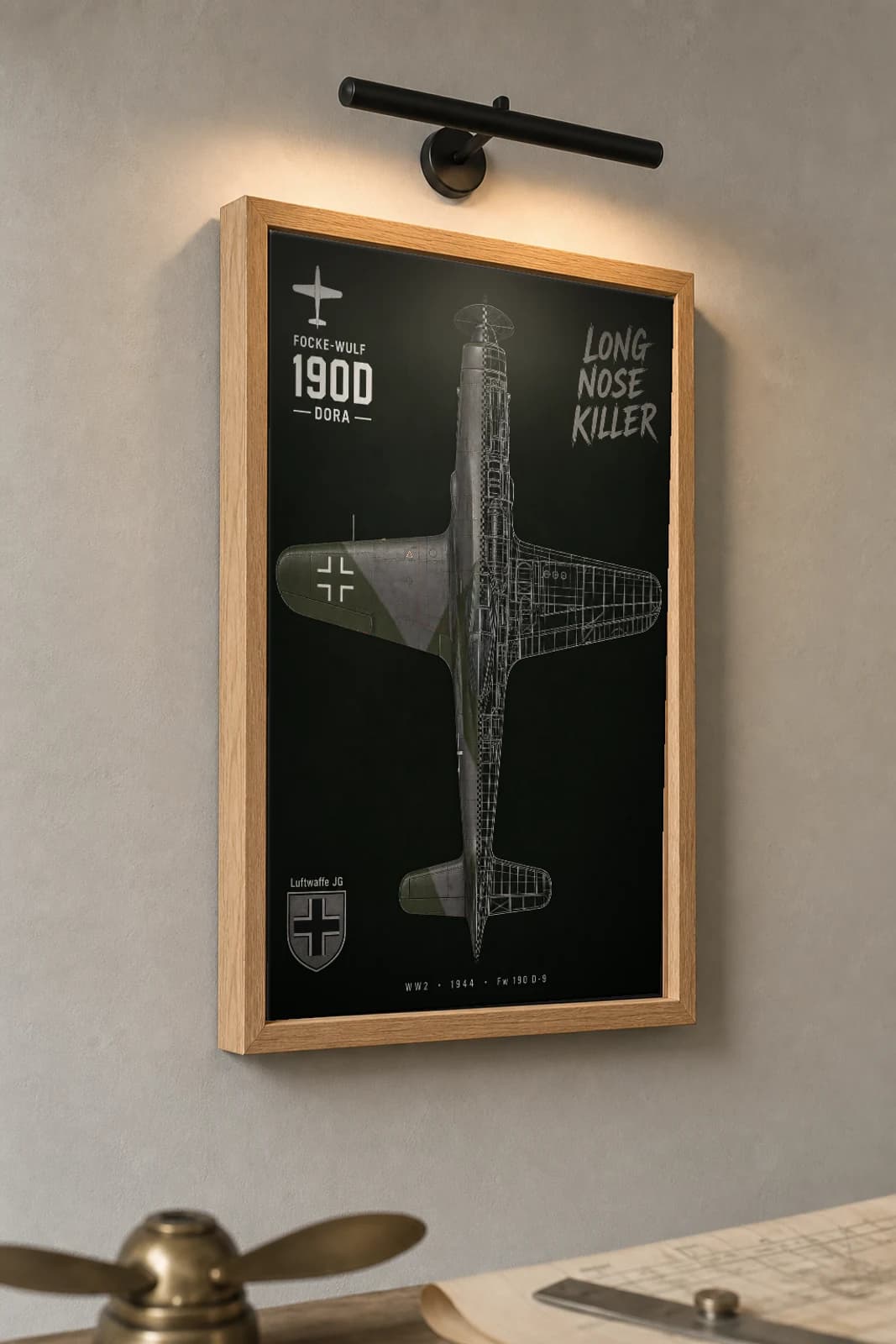 Focke-Wulf 190 Cutaway Poster — D-9 WW2 Split-View Blueprint Print — the framed print shown at a three-quarter angle on a styled gallery wall in a natural-oak frame