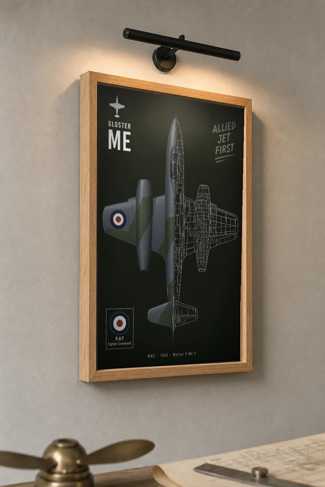 Gloster Meteor Cutaway Poster — F Mk 3 WW2 Split-View Blueprint Print — the framed print shown at a three-quarter angle on a styled gallery wall in a natural-oak frame
