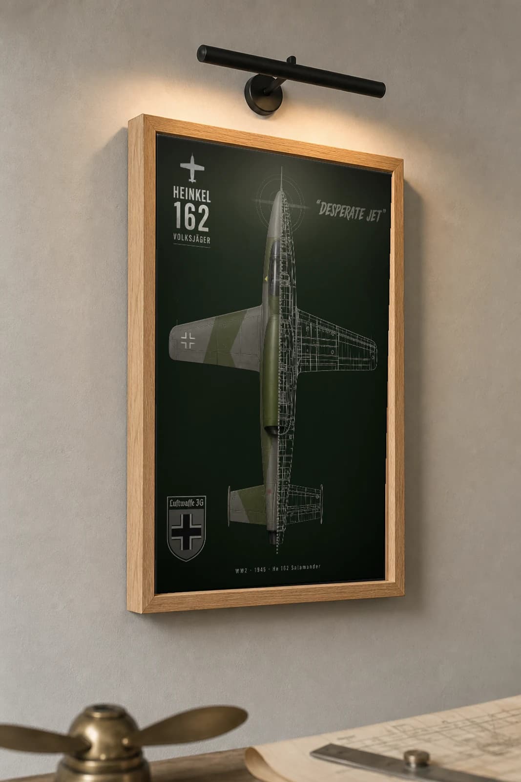Heinkel He 162 Cutaway Poster — Volksjäger Salamander WW2 Split-View Blueprint Print — the framed print shown at a three-quarter angle on a styled gallery wall in a natural-oak frame