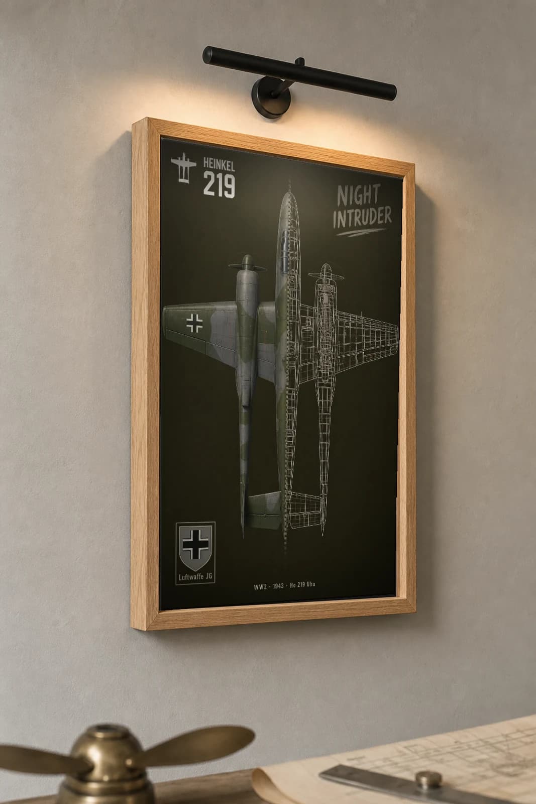 Heinkel He 219 Cutaway Poster — Uhu WW2 Split-View Blueprint Print — the framed print shown at a three-quarter angle on a styled gallery wall in a natural-oak frame