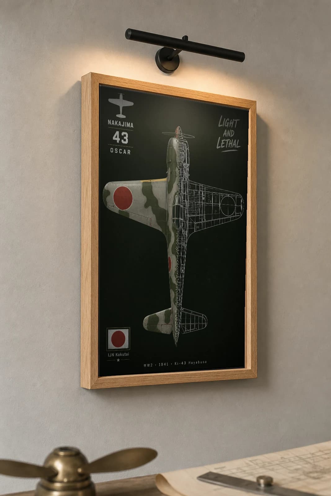 Ki-43 Hayabusa Cutaway Poster — Ki-43 Oscar WW2 Split-View Blueprint Print — the framed print shown at a three-quarter angle on a styled gallery wall in a natural-oak frame
