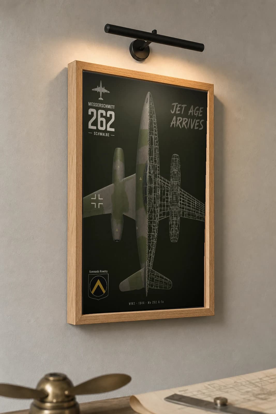 Messerschmitt Me 262 Cutaway Poster — A-1a WW2 Split-View Blueprint Print — the framed print shown at a three-quarter angle on a styled gallery wall in a natural-oak frame