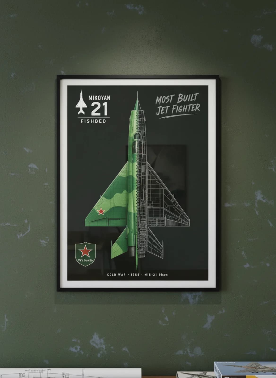MiG-21 Bison — Aircraft Cutaway cutaway poster in black A2 frame on two-tone-green-camo deep forest wall — Aircraft Cutaways enthusiast study mockup