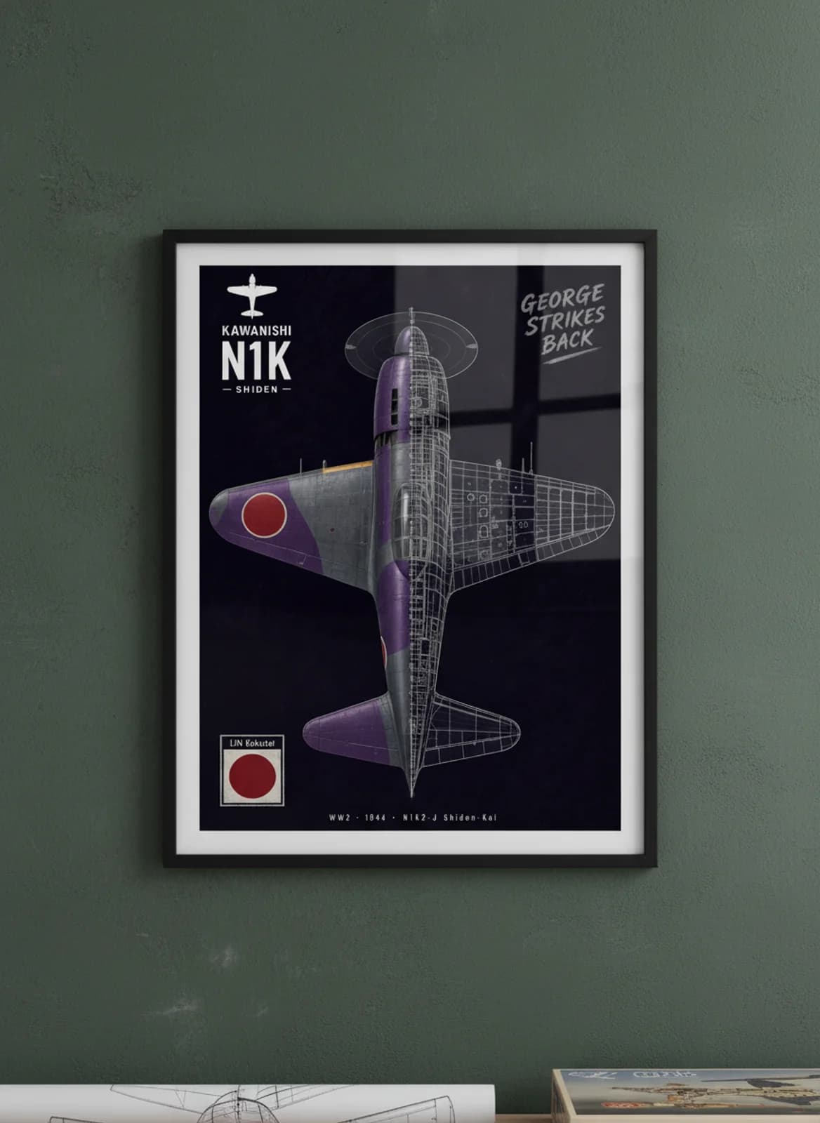 N1K2-J Shiden-Kai — Aircraft Cutaway cutaway poster in black A2 frame on purple-grey-camouflage deep forest wall — Aircraft Cutaways enthusiast study mockup