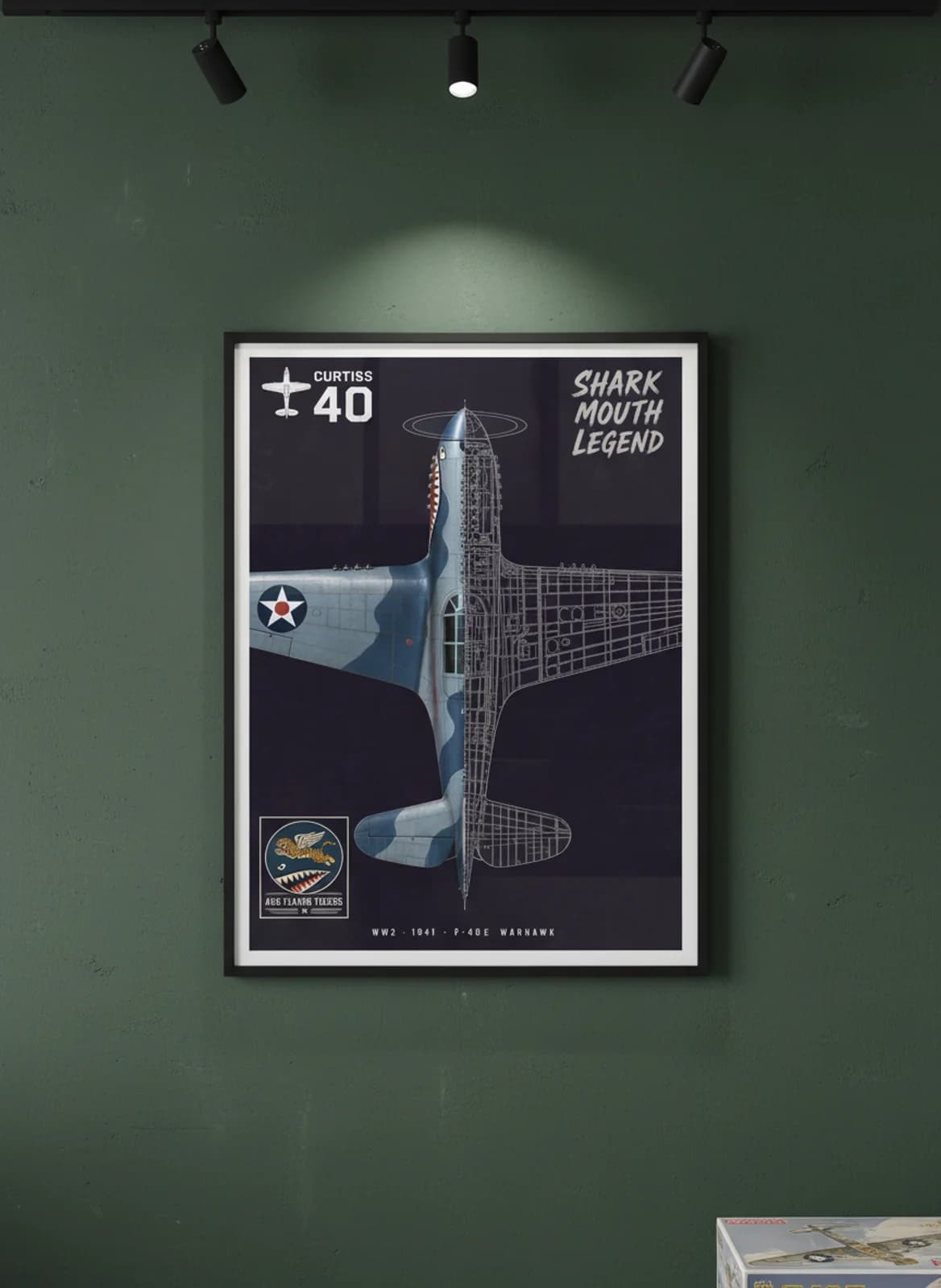 P-40E Warhawk — Aircraft Cutaway cutaway poster in black A2 frame on blue-grey-camouflage deep forest wall — Aircraft Cutaways enthusiast study mockup