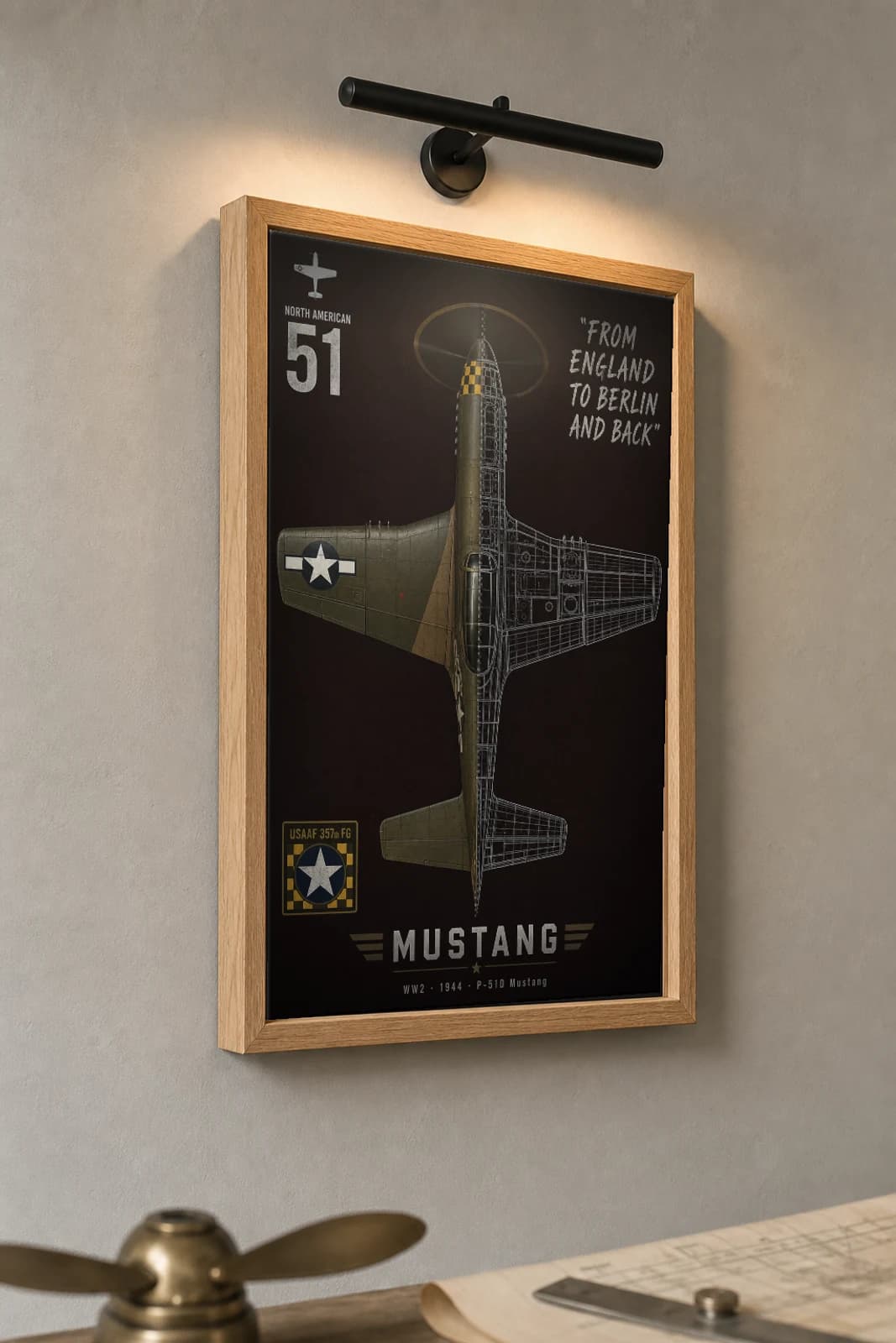 P-51 Mustang Cutaway Poster — P-51D WW2 Split-View Blueprint Print — the framed print shown at a three-quarter angle on a styled gallery wall in a natural-oak frame