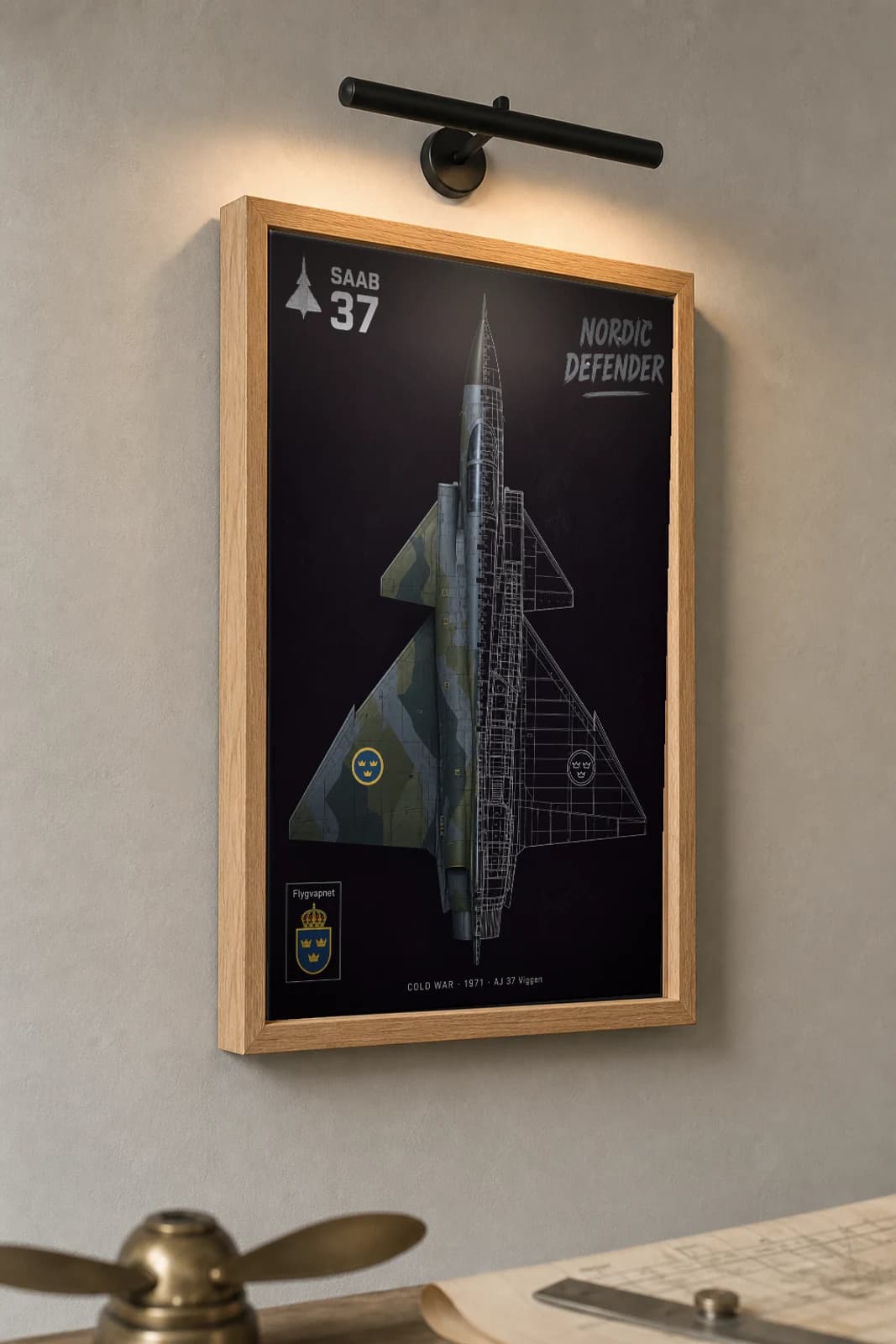 Saab AJ 37 Viggen Cutaway Poster — AJ 37 Viggen Cold War Split-View Blueprint Print — the framed print shown at a three-quarter angle on a styled gallery wall in a natural-oak frame