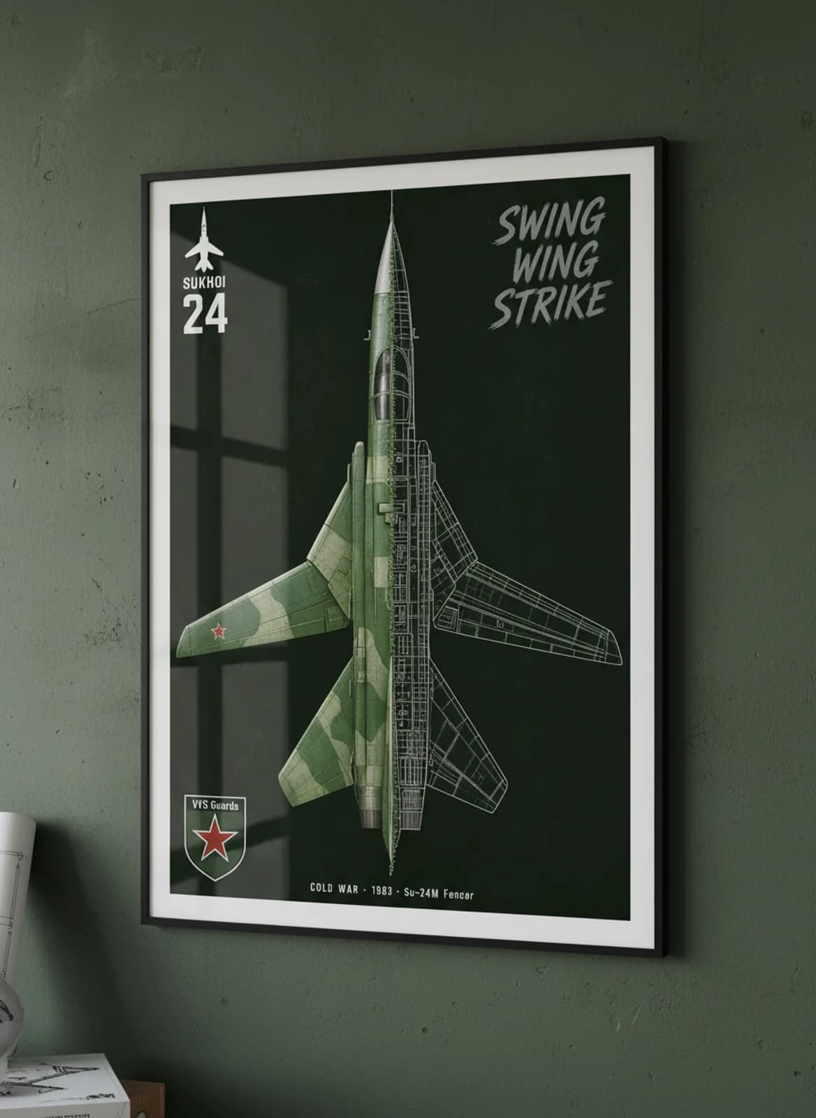 Su-24M Fencer cutaway poster in black A2 frame on soviet-green-camouflage deep forest wall — Aircraft Cutaways enthusiast study mockup