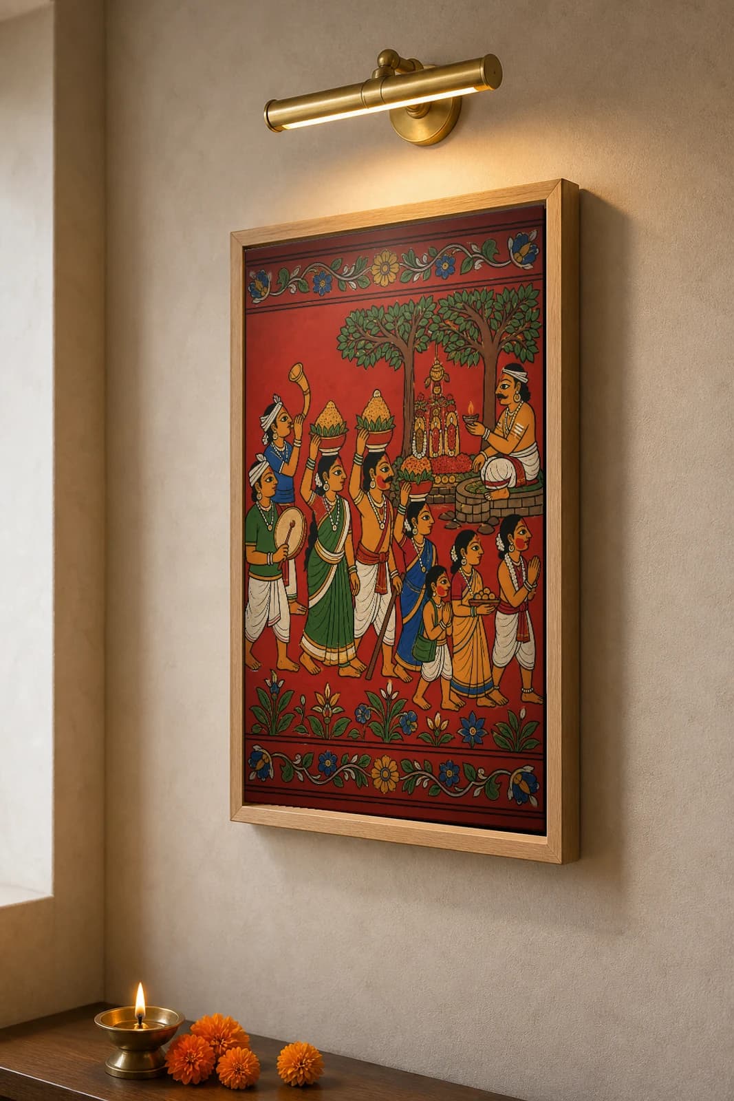 Medaram Sammakka-Saralamma Jatara Cheriyal Print — bangaram offerings carried to the forest shrine · collector edition on vermilion ground · Nakashi scroll grammar from Telangana — the framed print shown at a three-quarter angle on a styled gallery wall in a natural-oak frame