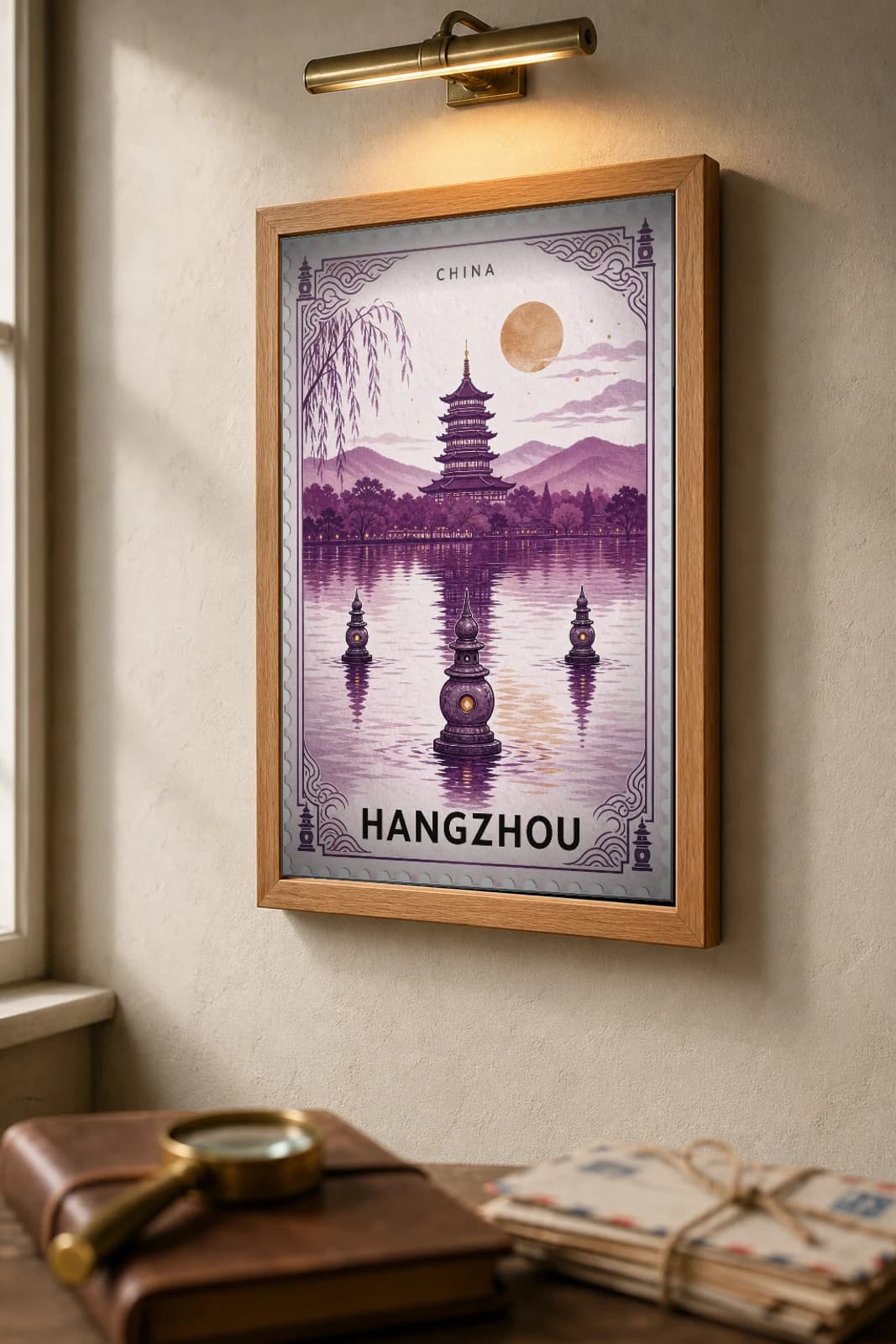 Hangzhou City Stamp Poster — China travel wall art · illustrated stamp print · framed A2 — the framed print shown at a three-quarter angle on a styled gallery wall in a natural-oak frame