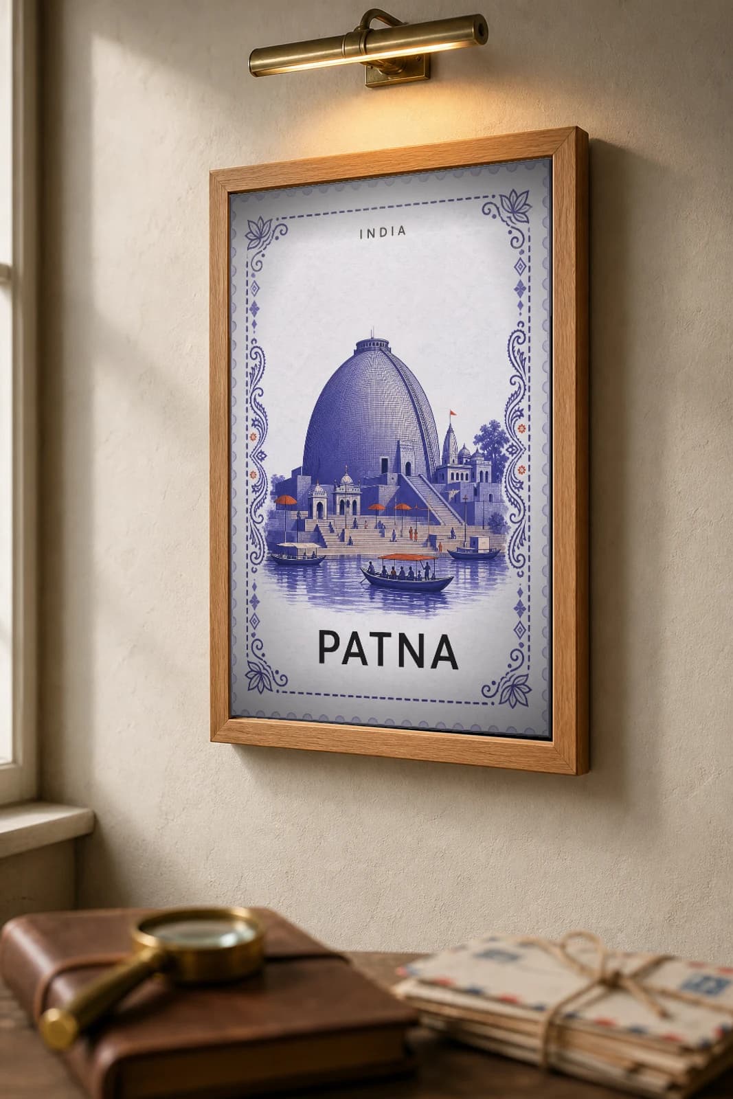 Patna City Stamp Poster — India travel wall art · illustrated stamp print · framed A2 — the framed print shown at a three-quarter angle on a styled gallery wall in a natural-oak frame