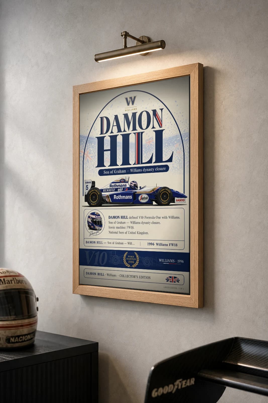 Damon Hill Poster — 1996 Williams FW18 V10 F1 Heritage Collector Print — the framed print shown at a three-quarter angle on a styled gallery wall in a natural-oak frame