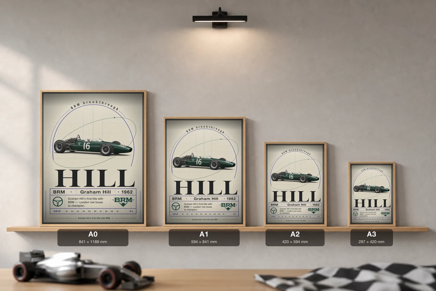 Graham Hill — Graham Hill — classic BRM 62 heritage plate Poster — 62 F1 Grid Editorial Wall Art · framed A2 — print size guide showing the artwork at A0, A1, A2 and A3 in natural-oak frames at true relative scale