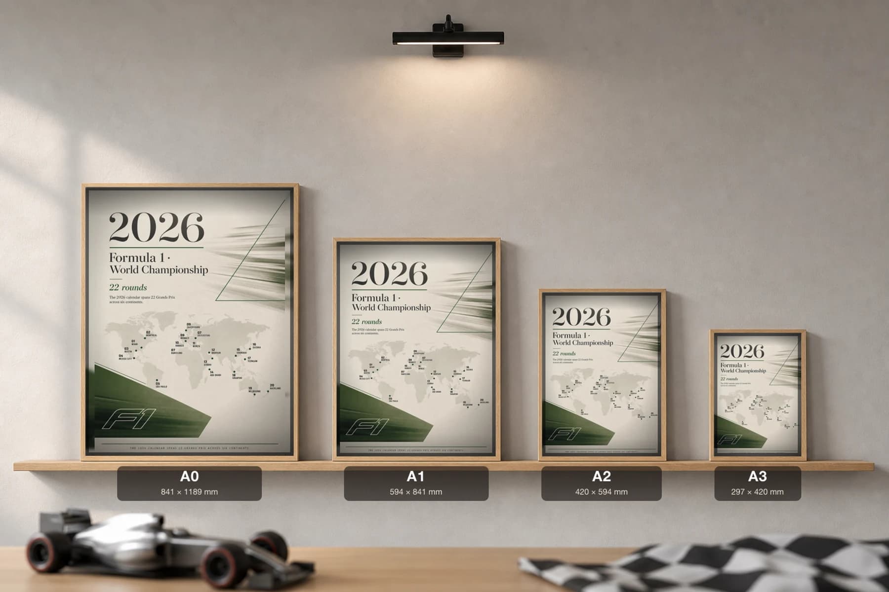 2026 Season — 2026 F1 calendar grid Poster — 2026 F1 Grid Editorial Wall Art · framed A2 — print size guide showing the artwork at A0, A1, A2 and A3 in natural-oak frames at true relative scale