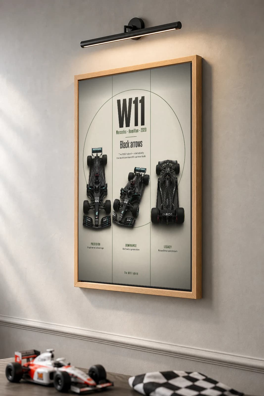 Lewis Hamilton — Mercedes W11 record season Poster — 2020 F1 Grid Editorial Wall Art · framed A2 — the framed print shown at a three-quarter angle on a styled gallery wall in a natural-oak frame