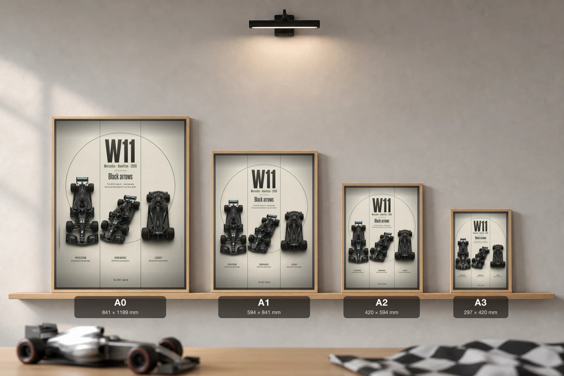 Lewis Hamilton — Mercedes W11 record season Poster — 2020 F1 Grid Editorial Wall Art · framed A2 — print size guide showing the artwork at A0, A1, A2 and A3 in natural-oak frames at true relative scale