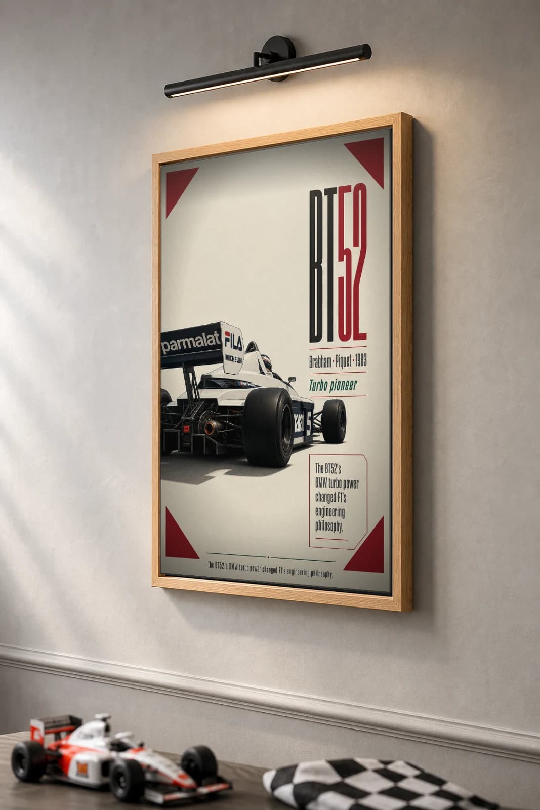 Nelson Piquet — Brabham BT52 turbo title Poster — 1983 F1 Grid Editorial Wall Art · framed A2 — the framed print shown at a three-quarter angle on a styled gallery wall in a natural-oak frame