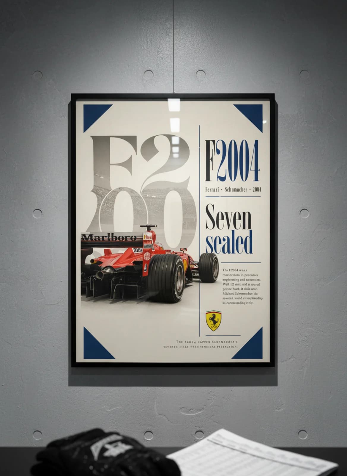 Michael Schumacher — Ferrari F2004 perfection F1 Grid print in black A2 frame on gold-seal-accent editorial-slate wall — Formula 1 media room mockup