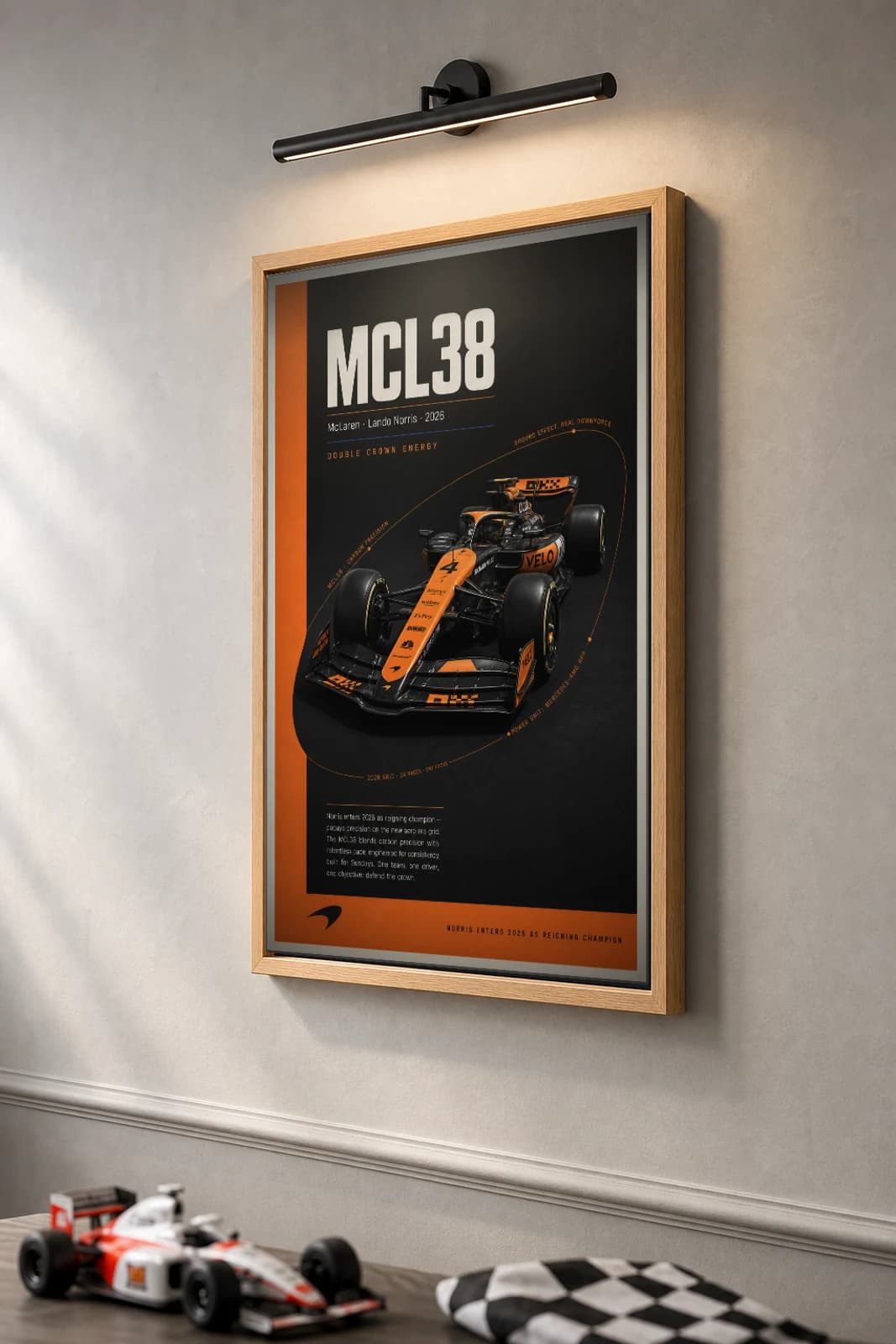 McLaren MCL38 — Lando Norris Poster — undefined F1 Grid Editorial Wall Art · framed A2 — the framed print shown at a three-quarter angle on a styled gallery wall in a natural-oak frame