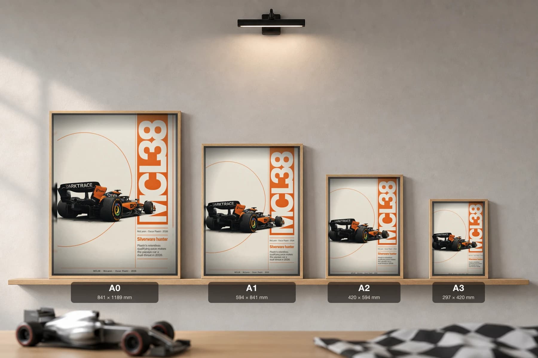McLaren MCL38 — Oscar Piastri Poster — undefined F1 Grid Editorial Wall Art · framed A2 — print size guide showing the artwork at A0, A1, A2 and A3 in natural-oak frames at true relative scale