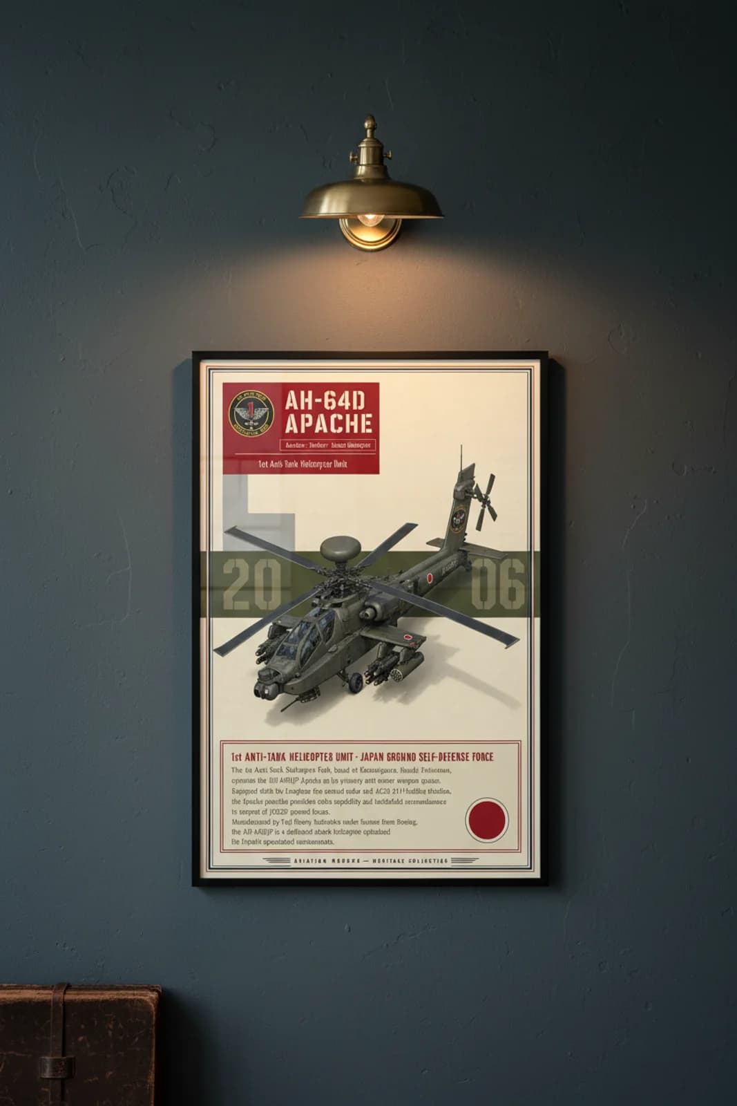 AH-64D Apache aviation poster in black A2 frame on olive-drab-grey-green navy hangar wall — Aviation Heroes mockup