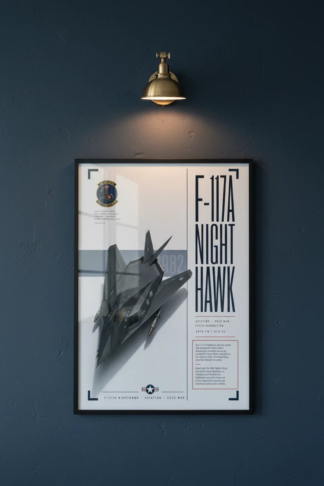 F-117A Nighthawk aviation poster in black A2 frame on matte-dark-grey navy hangar wall — Aviation Heroes mockup