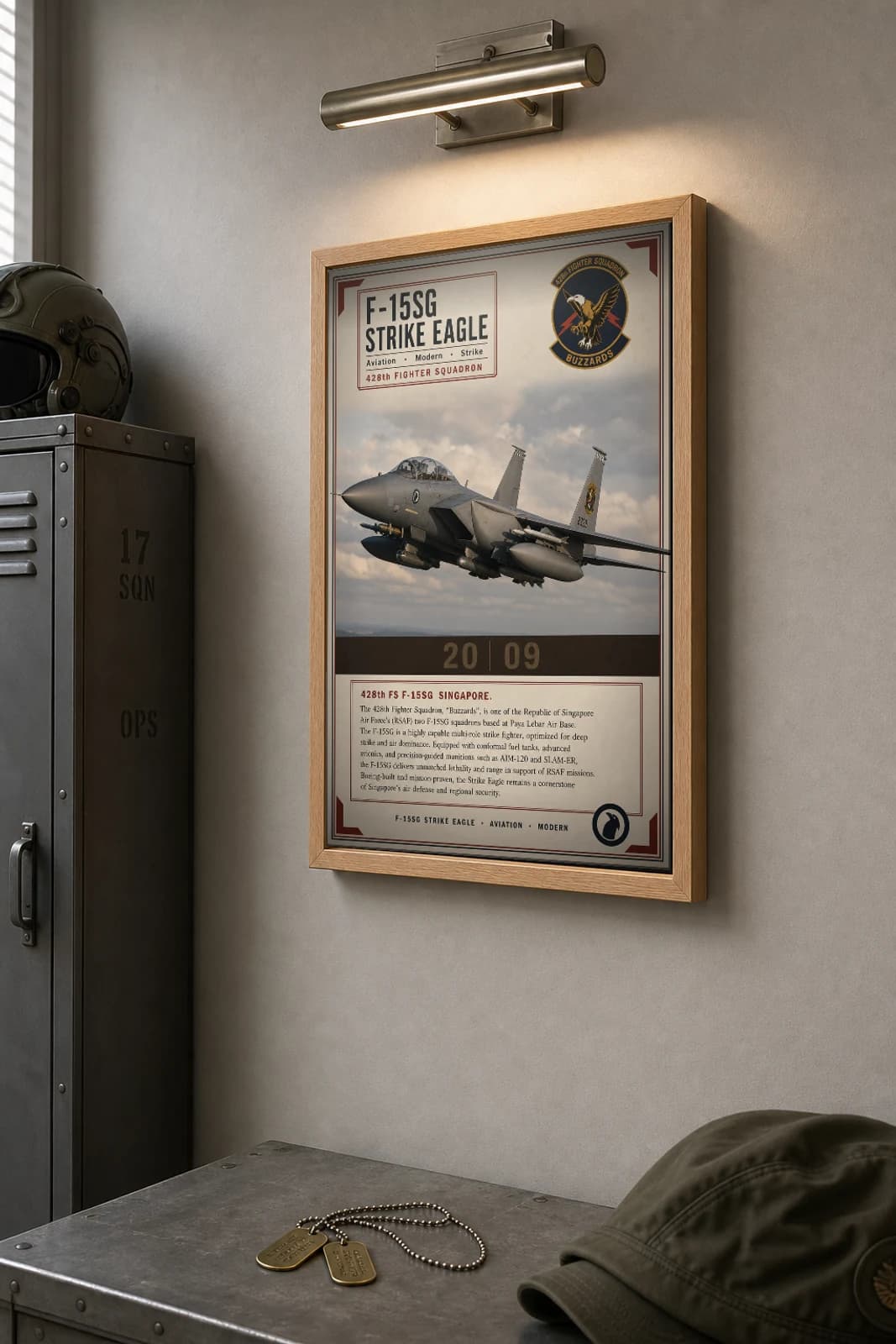 F-15SG Strike Eagle Poster — 428th Fighter Squadron military aviation wall art · framed A2 · 2009 — the framed print shown at a three-quarter angle on a styled gallery wall in a natural-oak frame