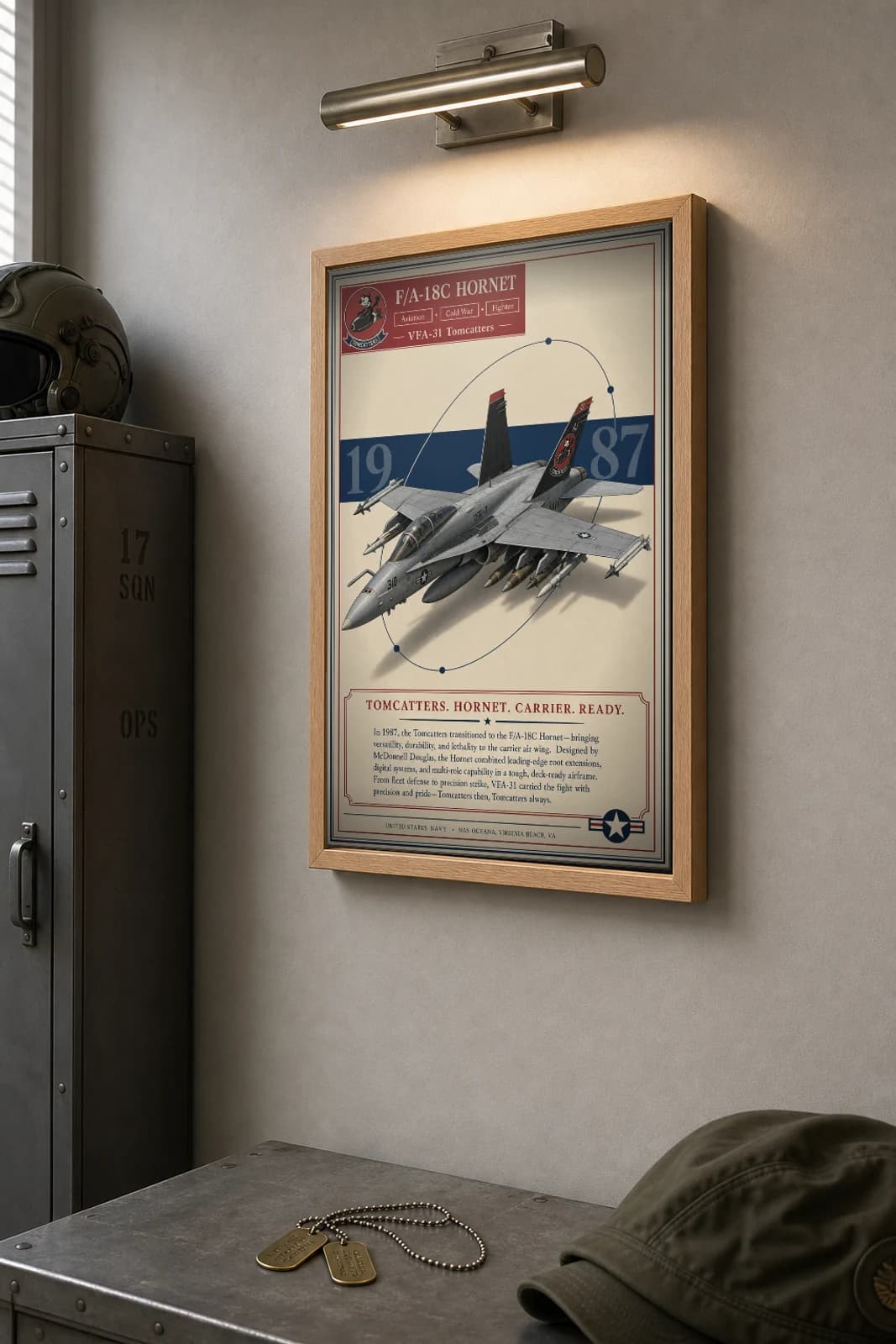 F/A-18 Hornet Poster — VFA-31 Tomcatters military aviation wall art · framed A2 · 1987 — the framed print shown at a three-quarter angle on a styled gallery wall in a natural-oak frame