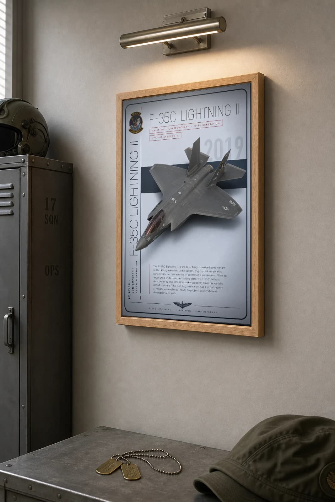 F-35C Lightning II Poster — VFA-147 Argonauts military aviation wall art · framed A2 · 2019 — the framed print shown at a three-quarter angle on a styled gallery wall in a natural-oak frame