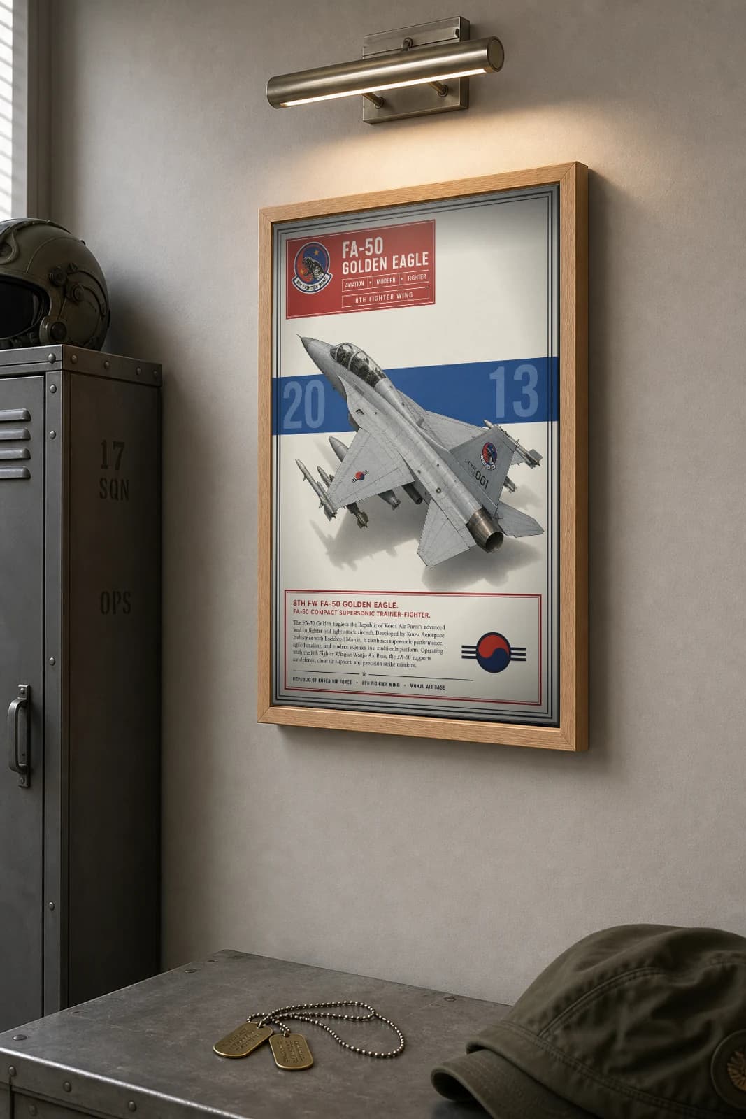 FA-50 Golden Eagle Poster — 8th Fighter Wing military aviation wall art · framed A2 · 2013 — the framed print shown at a three-quarter angle on a styled gallery wall in a natural-oak frame