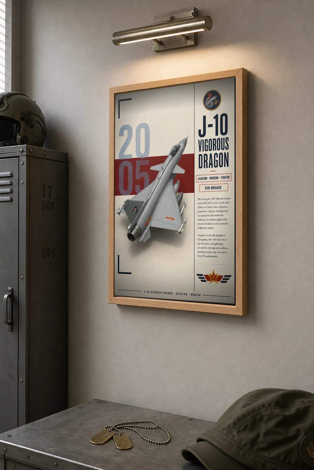 J-10A Vigorous Dragon Poster — 8th Brigade military aviation wall art · framed A2 · 2005 — the framed print shown at a three-quarter angle on a styled gallery wall in a natural-oak frame