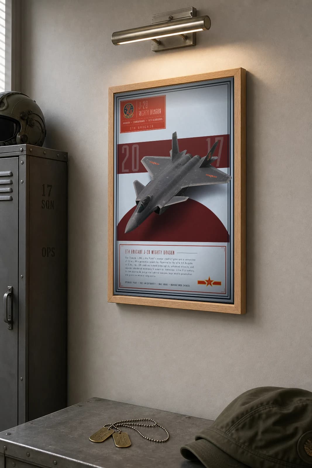 J-20 Mighty Dragon Poster — 9th Brigade military aviation wall art · framed A2 · 2017 — the framed print shown at a three-quarter angle on a styled gallery wall in a natural-oak frame