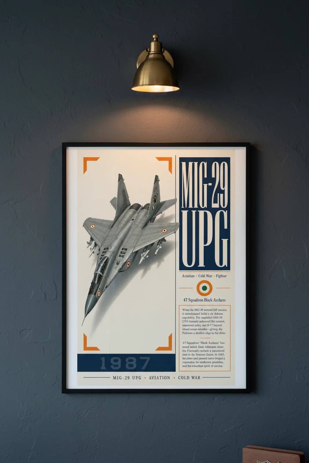 MiG-29 UPG Fulcrum aviation poster in black A2 frame on iaf-grey navy hangar wall — Aviation Heroes mockup
