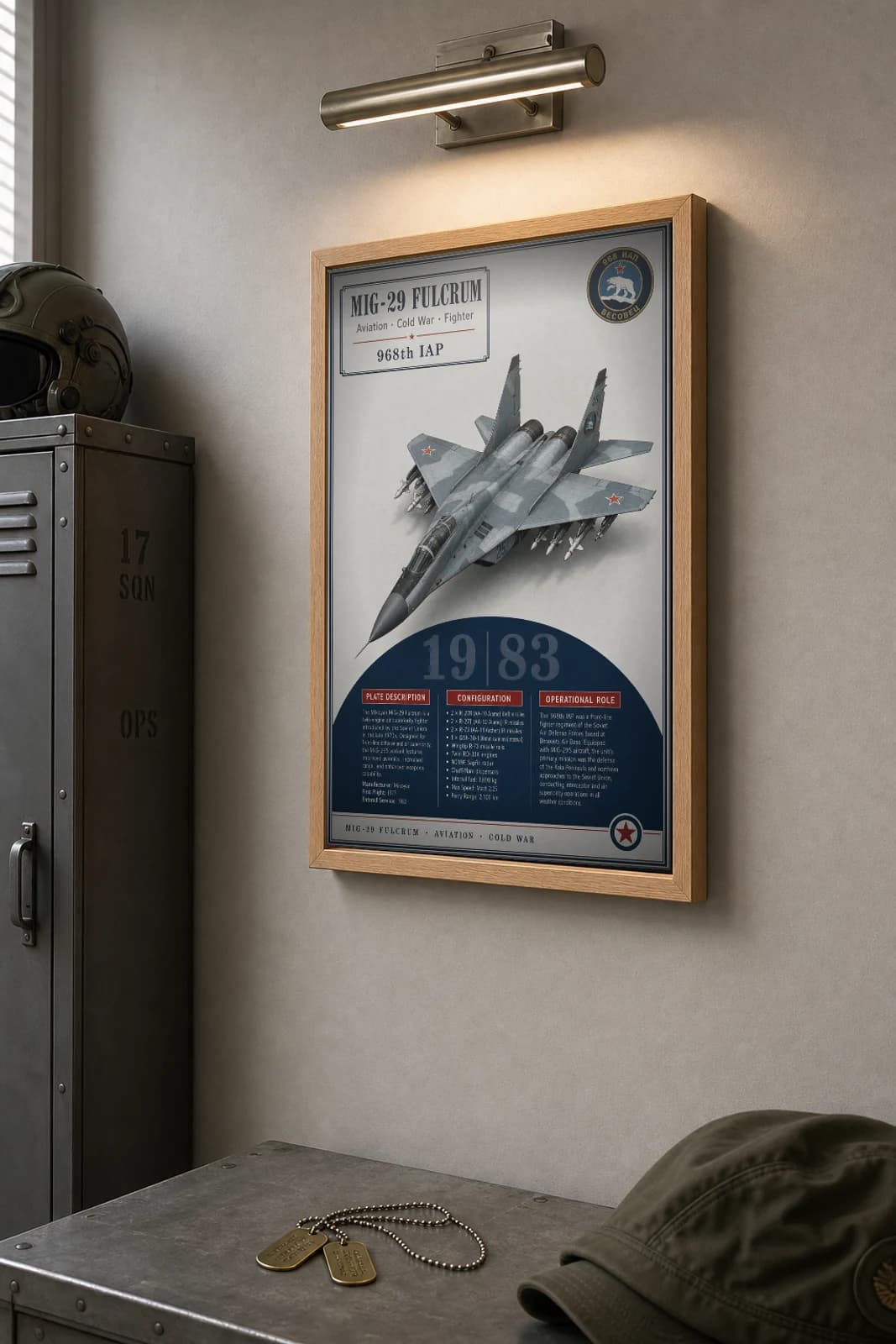 MiG-29 Fulcrum Poster — 968th IAP military aviation wall art · framed A2 · 1983 — the framed print shown at a three-quarter angle on a styled gallery wall in a natural-oak frame