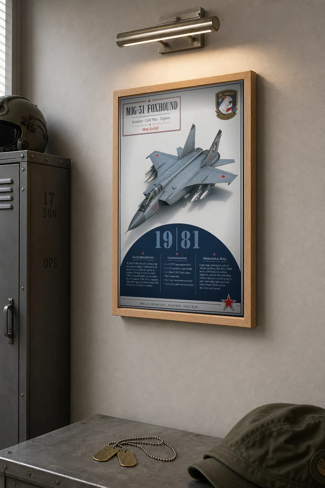 MiG-31 Foxhound Poster — 98th GvIAP military aviation wall art · framed A2 · 1981 — the framed print shown at a three-quarter angle on a styled gallery wall in a natural-oak frame