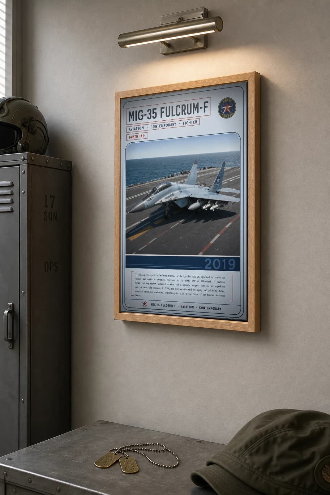 MiG-35 Fulcrum-F Poster — 148th IAP military aviation wall art · framed A2 · 2019 — the framed print shown at a three-quarter angle on a styled gallery wall in a natural-oak frame