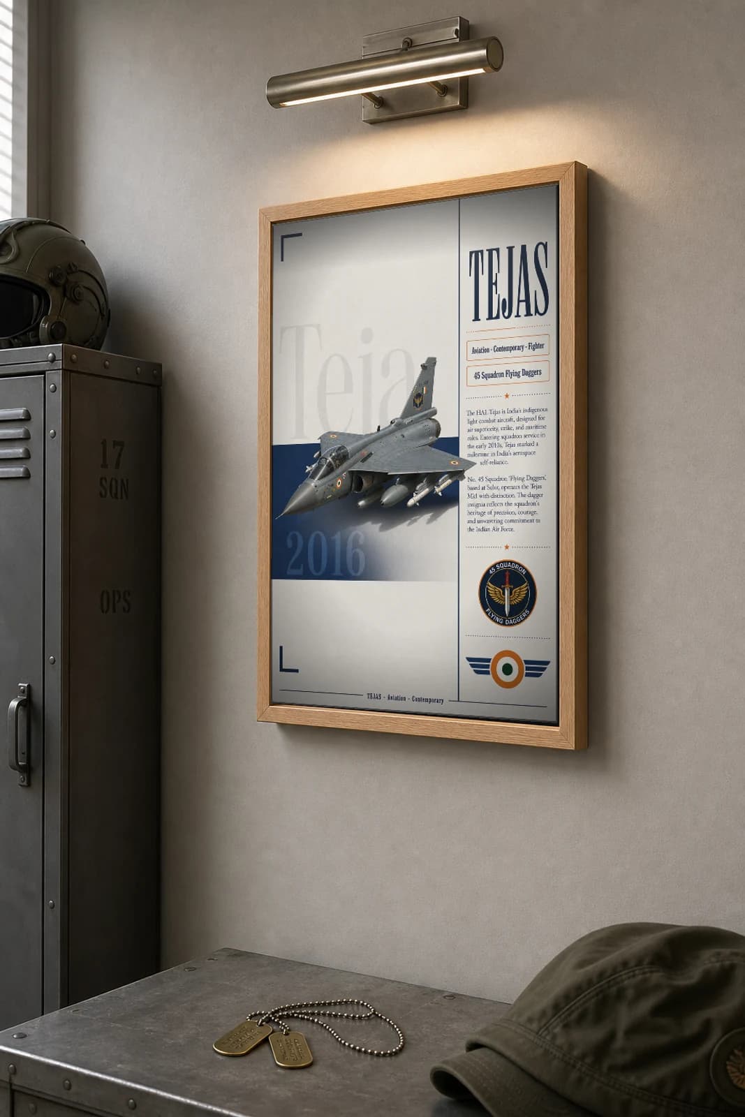 Tejas Mk1 Poster — 45 Squadron Flying Daggers military aviation wall art · framed A2 · 2016 — the framed print shown at a three-quarter angle on a styled gallery wall in a natural-oak frame