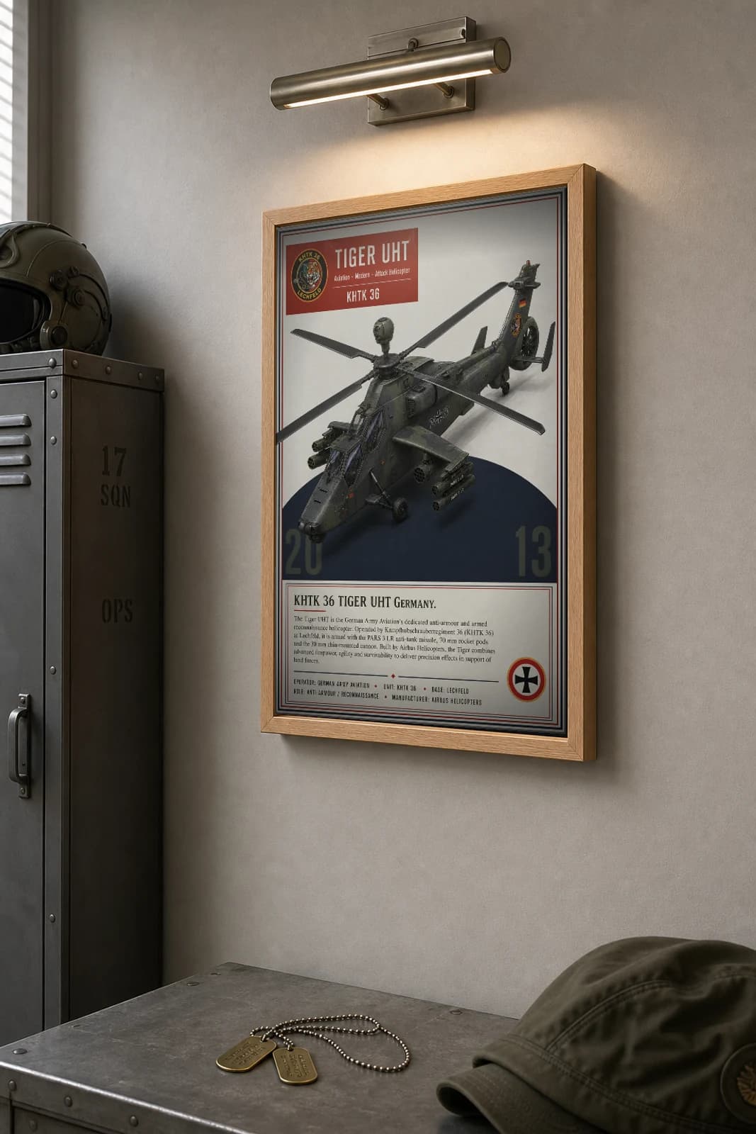 Eurocopter Tiger UHT Poster — KHTK 36 military aviation wall art · framed A2 · 2013 — the framed print shown at a three-quarter angle on a styled gallery wall in a natural-oak frame
