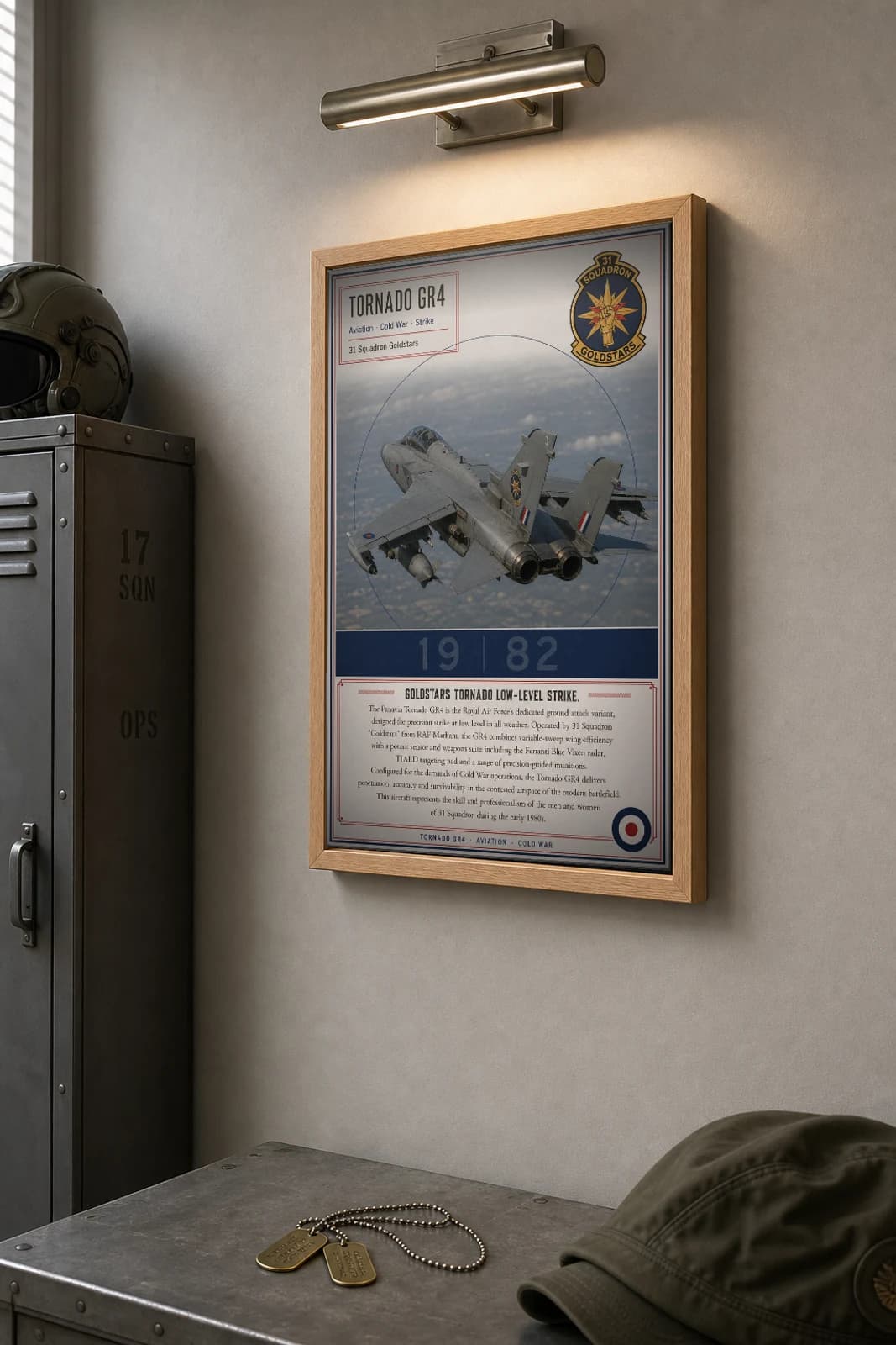 Tornado GR4 Poster — 31 Squadron Goldstars military aviation wall art · framed A2 · 1982 — the framed print shown at a three-quarter angle on a styled gallery wall in a natural-oak frame