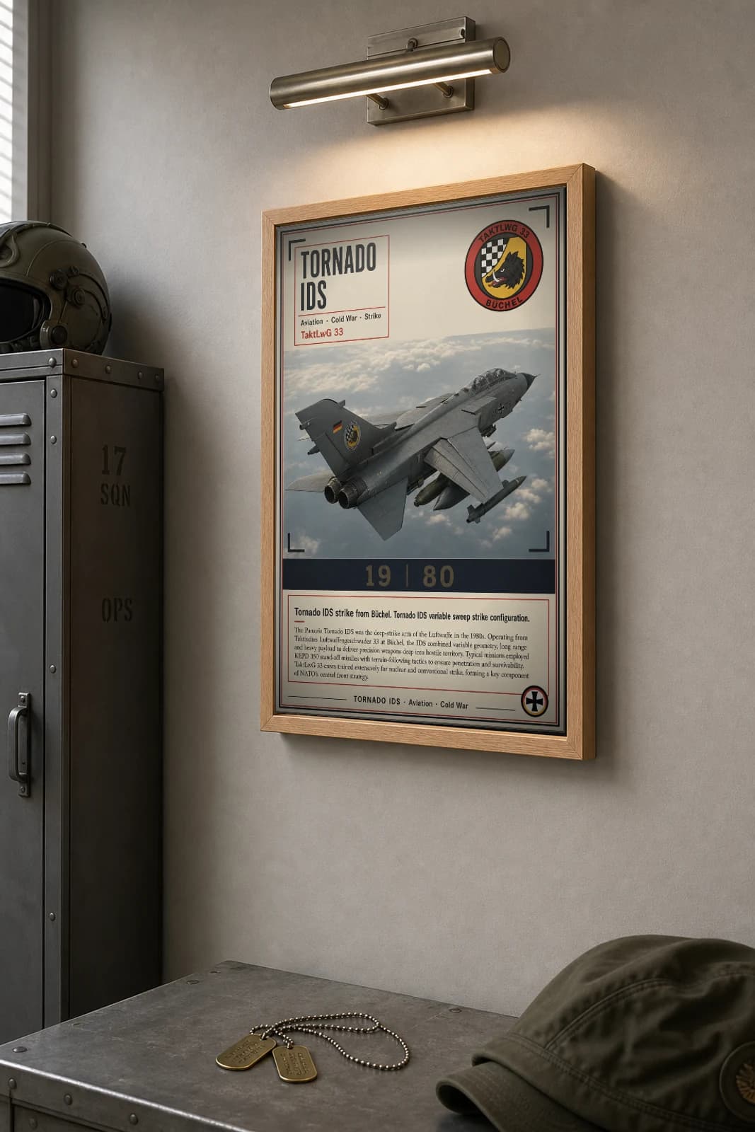 Tornado IDS Poster — TaktLwG 33 military aviation wall art · framed A2 · 1980 — the framed print shown at a three-quarter angle on a styled gallery wall in a natural-oak frame