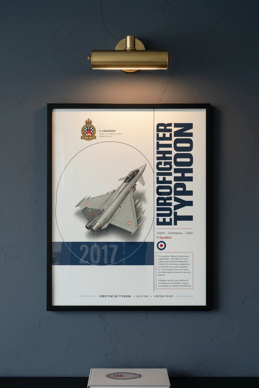 Eurofighter Typhoon aviation poster in black A2 frame on low-visibility-grey navy hangar wall — Aviation Heroes mockup