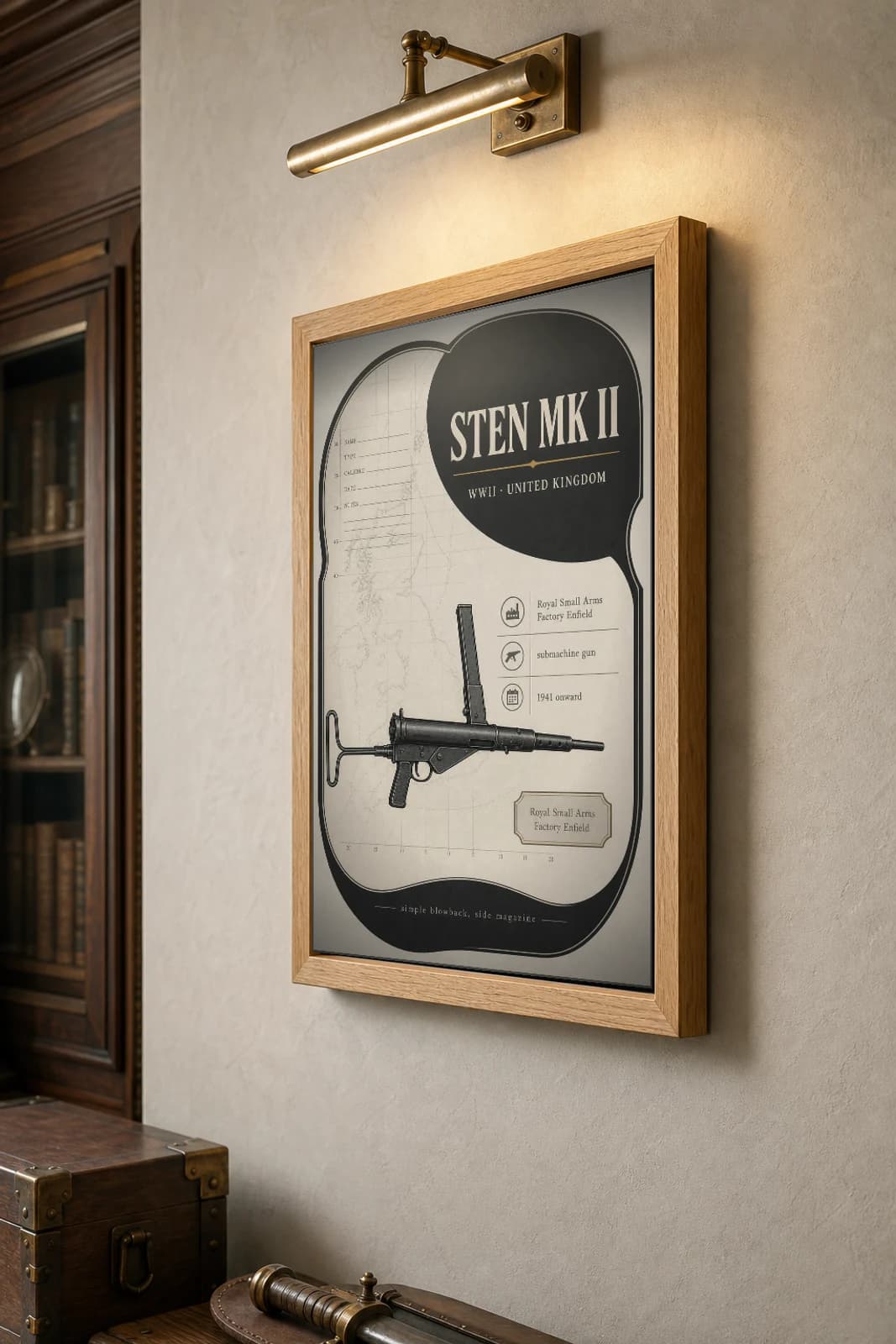Sten Mk II Poster — WWII Armoury Specimen Print · framed A2 — the framed print shown at a three-quarter angle on a styled gallery wall in a natural-oak frame