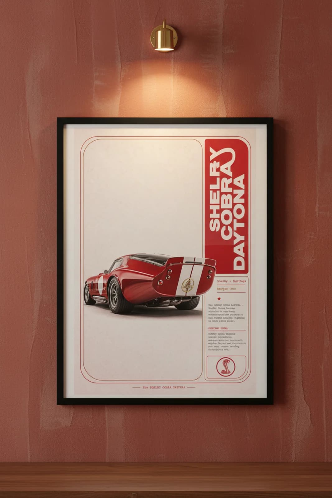 Cobra Daytona Coupe poster in black A2 frame on rosso-red lime-wash wall — Heritage Icons collector lounge mockup