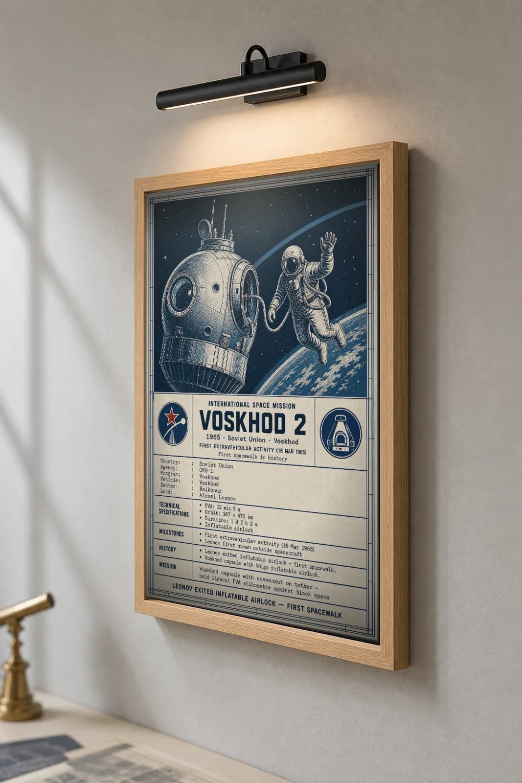 VOSKHOD 2 Poster — 1965 OKB-1 International Space Mission Print · framed A2 — the framed print shown at a three-quarter angle on a styled gallery wall in a natural-oak frame