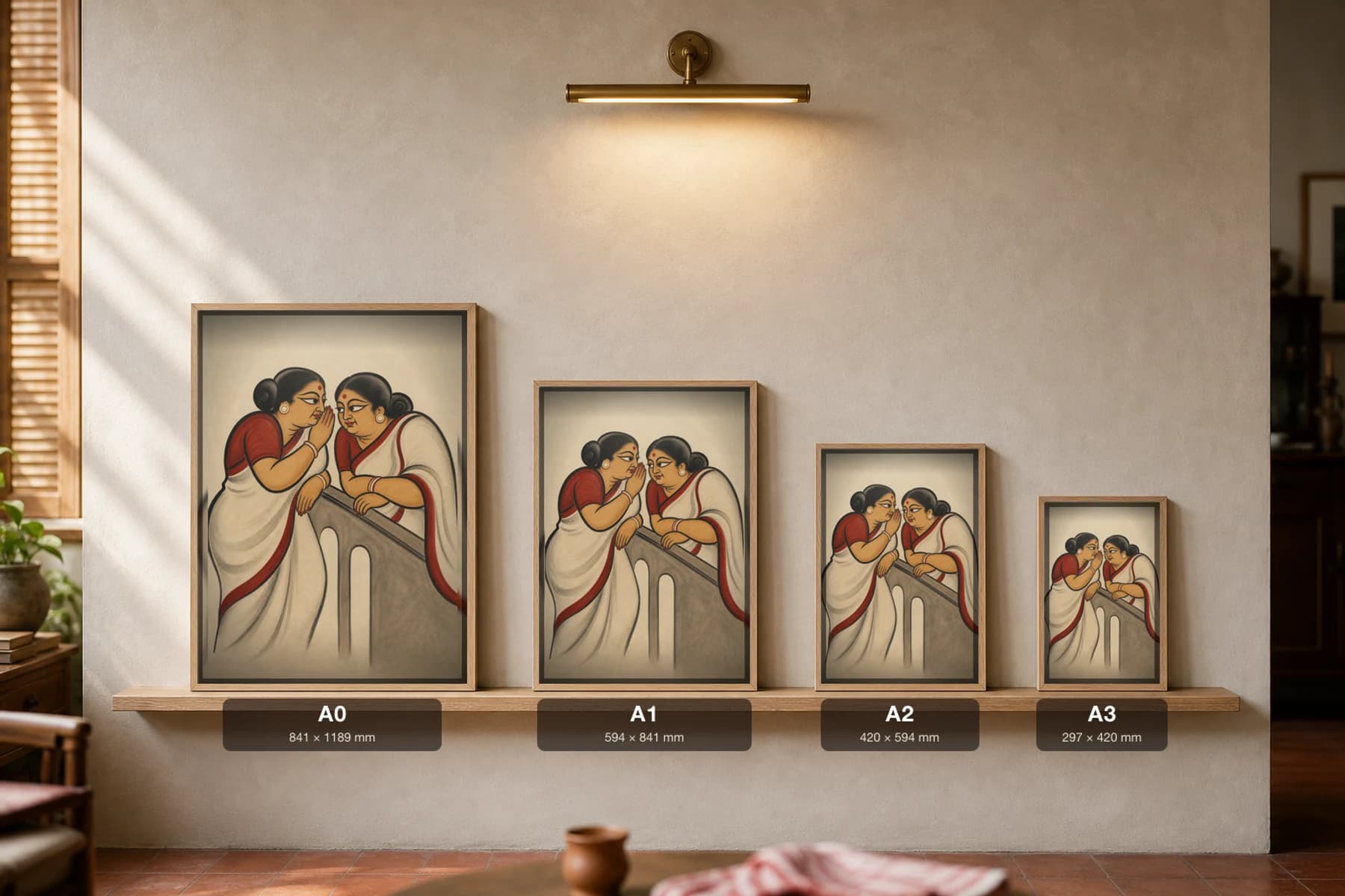 The Gossiping Kakimas Kalighat Print — two aunties trading neighbourhood gossip over a balcony rail, contemporary Bengal patua satire, hand-numbered collector edition — print size guide showing the artwork at A0, A1, A2 and A3 in natural-oak frames at true relative scale