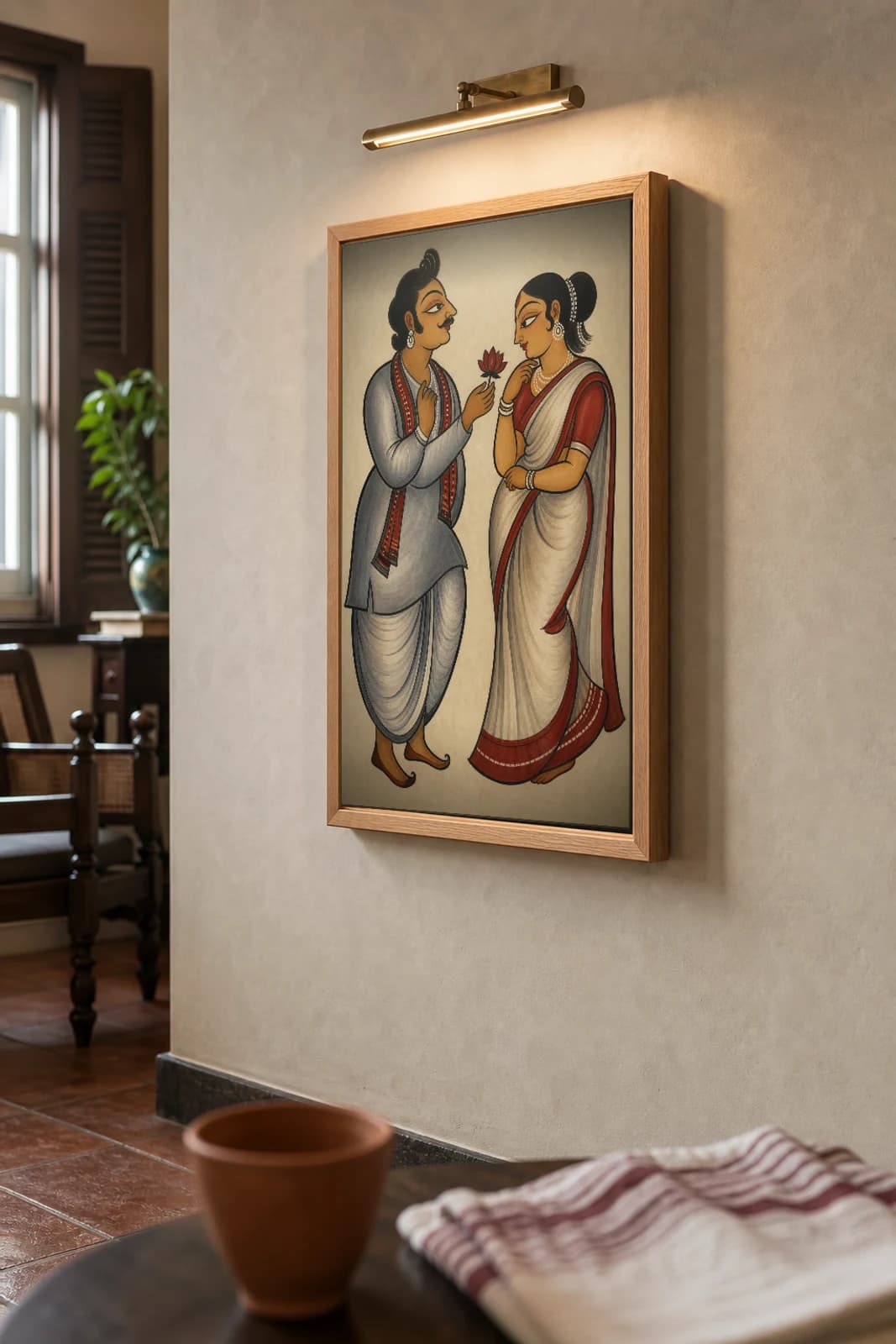 Babu and Courtesan Kalighat Print — the colonial dandy offers a lotus to the bibi, 19th-century Bengal patua social satire, hand-numbered collector edition — the framed print shown at a three-quarter angle on a styled gallery wall in a natural-oak frame