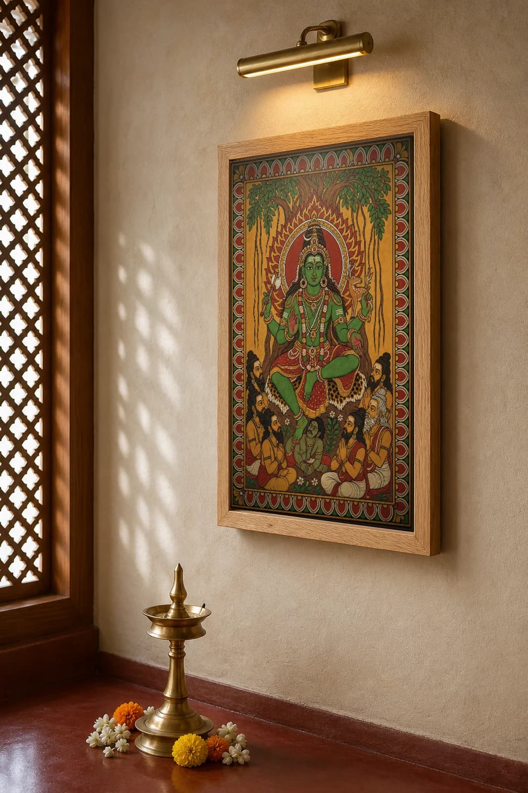 Dakshinamurthy Kerala Mural Art Print — Shiva as supreme teacher under the banyan in flat panchavarna bhitti-chitra style, collector edition of 500 — the framed print shown at a three-quarter angle on a styled gallery wall in a natural-oak frame