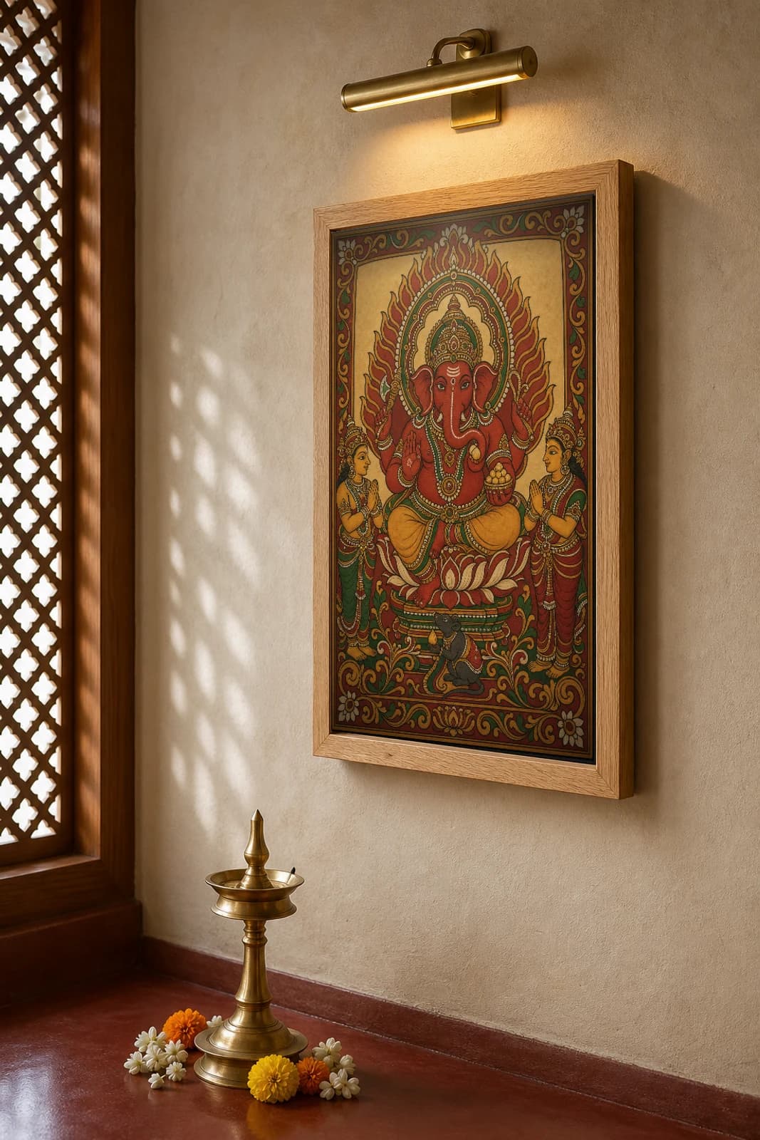 Ganapati Vighnaharta Kerala Mural Art Print — lotus-seated Ganesha with mouse in flat panchavarna bhitti-chitra style, collector edition of 500 — the framed print shown at a three-quarter angle on a styled gallery wall in a natural-oak frame